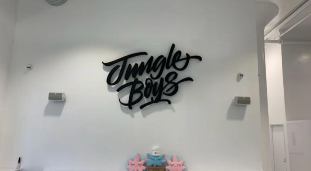 Wall with "Jungle Boys" graffiti logo.