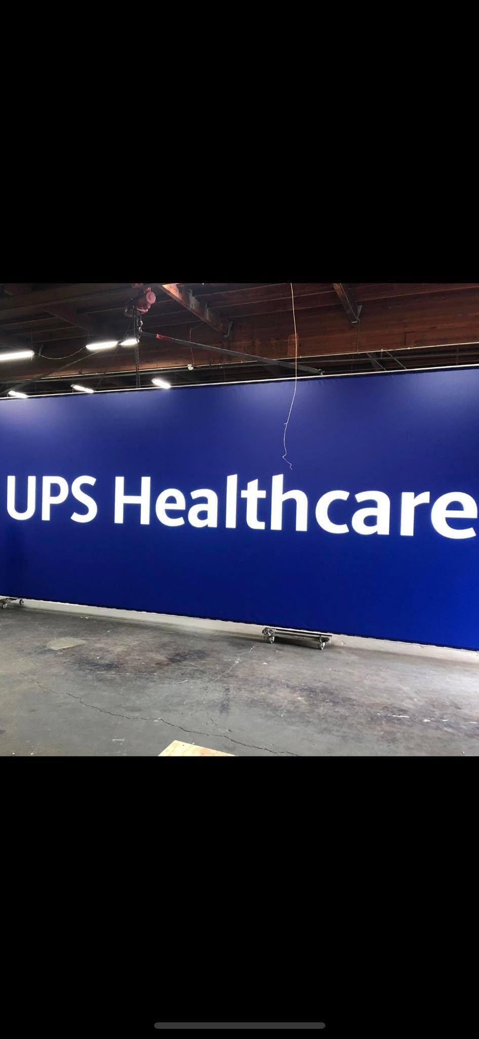 UPS Healthcare sign in industrial setting.
