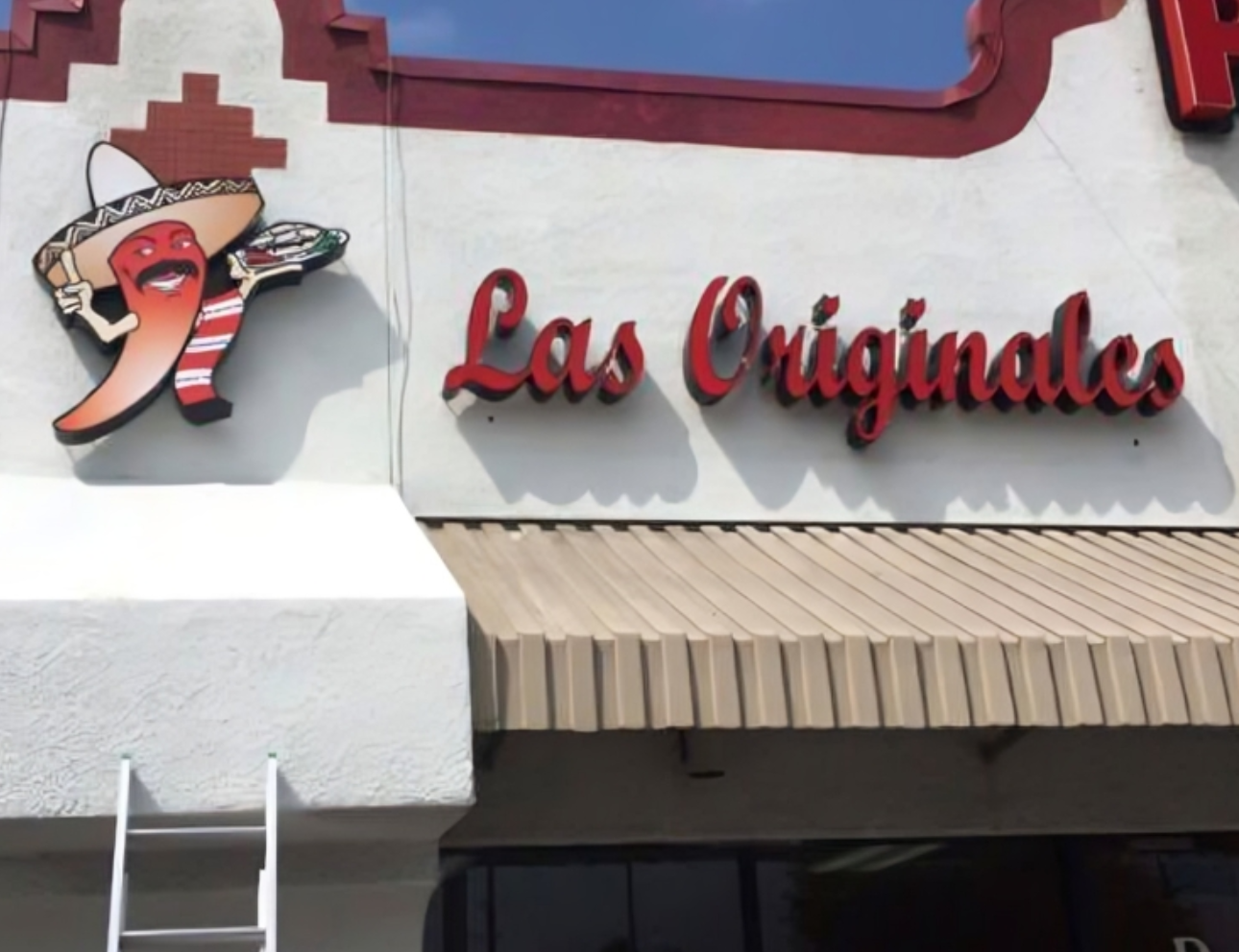 Storefront with "Las Originales" sign and chili.