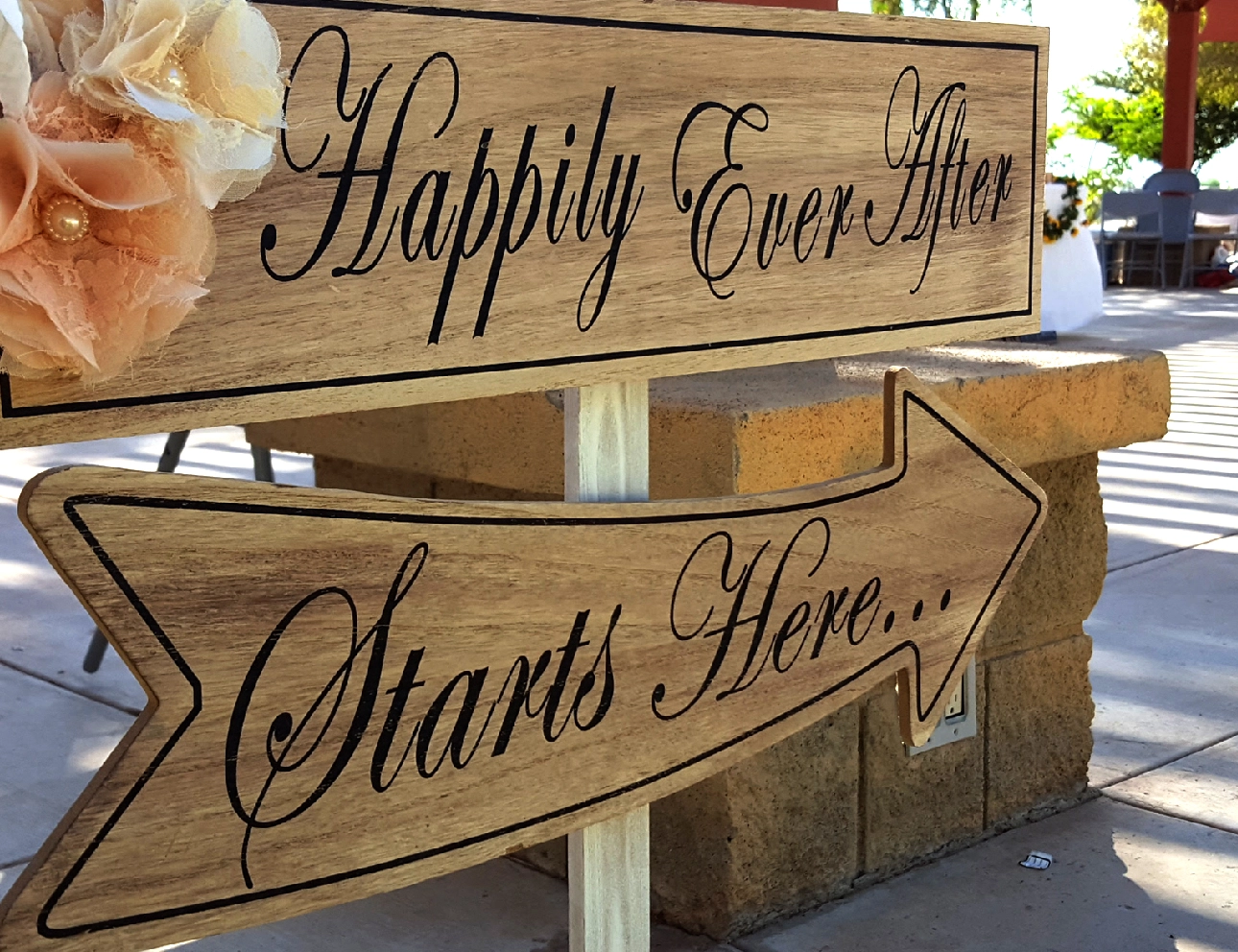 Wedding sign: "Happily Ever After Starts Here.