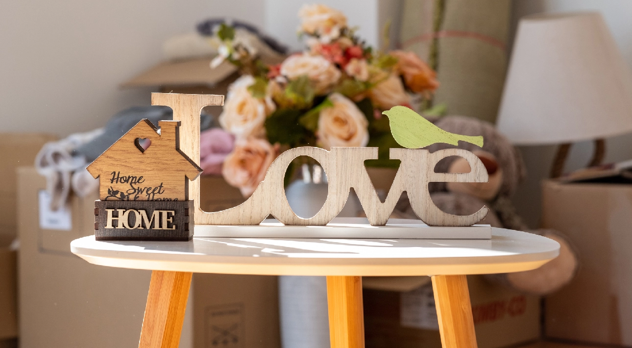 Decorative "Home" and "Love" signs on table.
