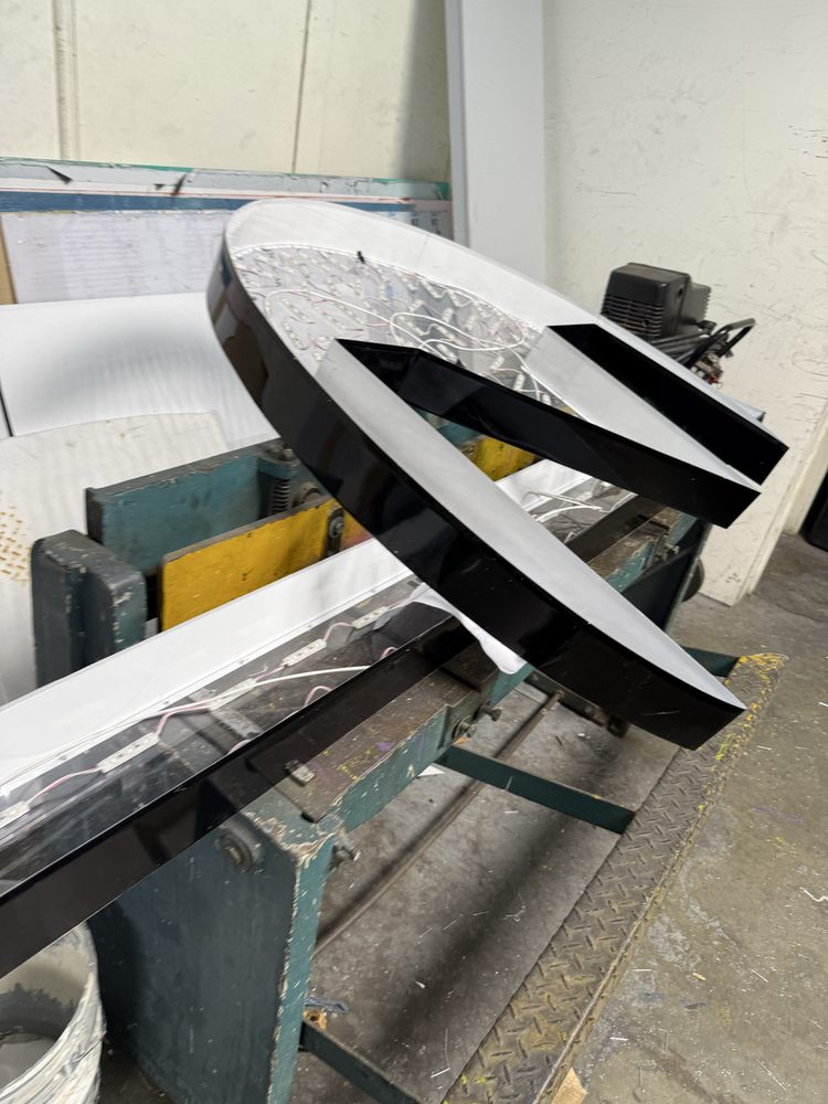 Large letter sign in workshop setting.