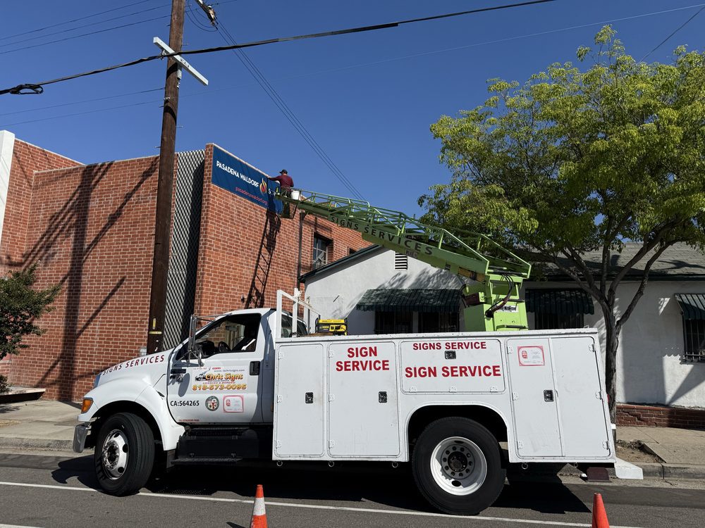 Truck providing sign installation service.
