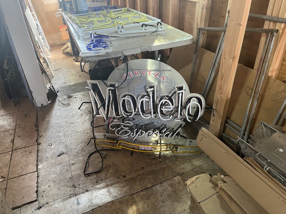 Modelo Especial sign in cluttered storage room.