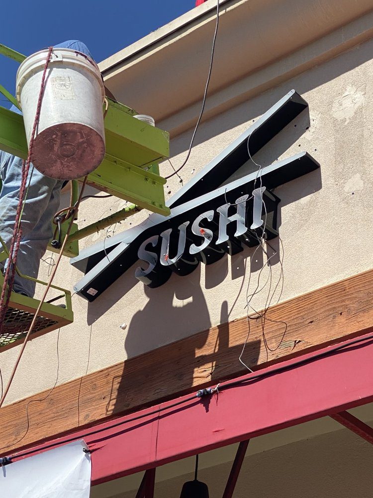 Sign installation for a sushi restaurant.