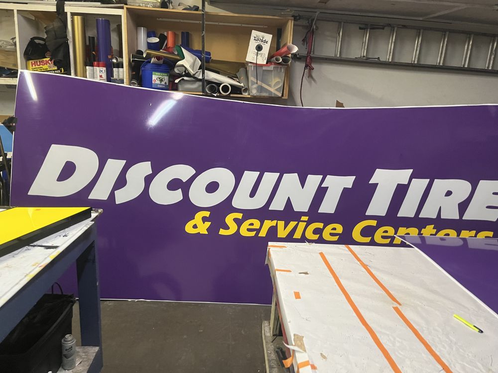 Discount Tire sign in a workshop.