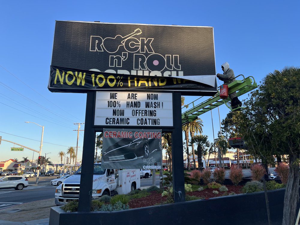 Rock n' Roll car wash sign installation.