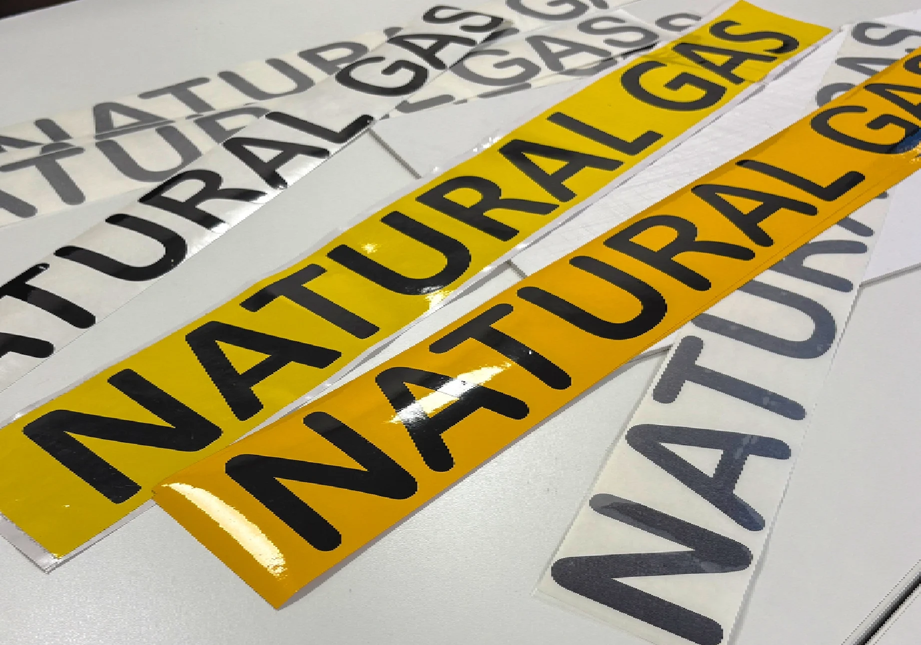 Natural gas stickers on a table.