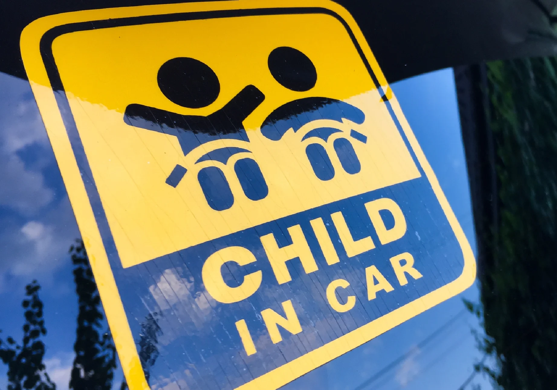Yellow "Child in Car" safety sticker.
