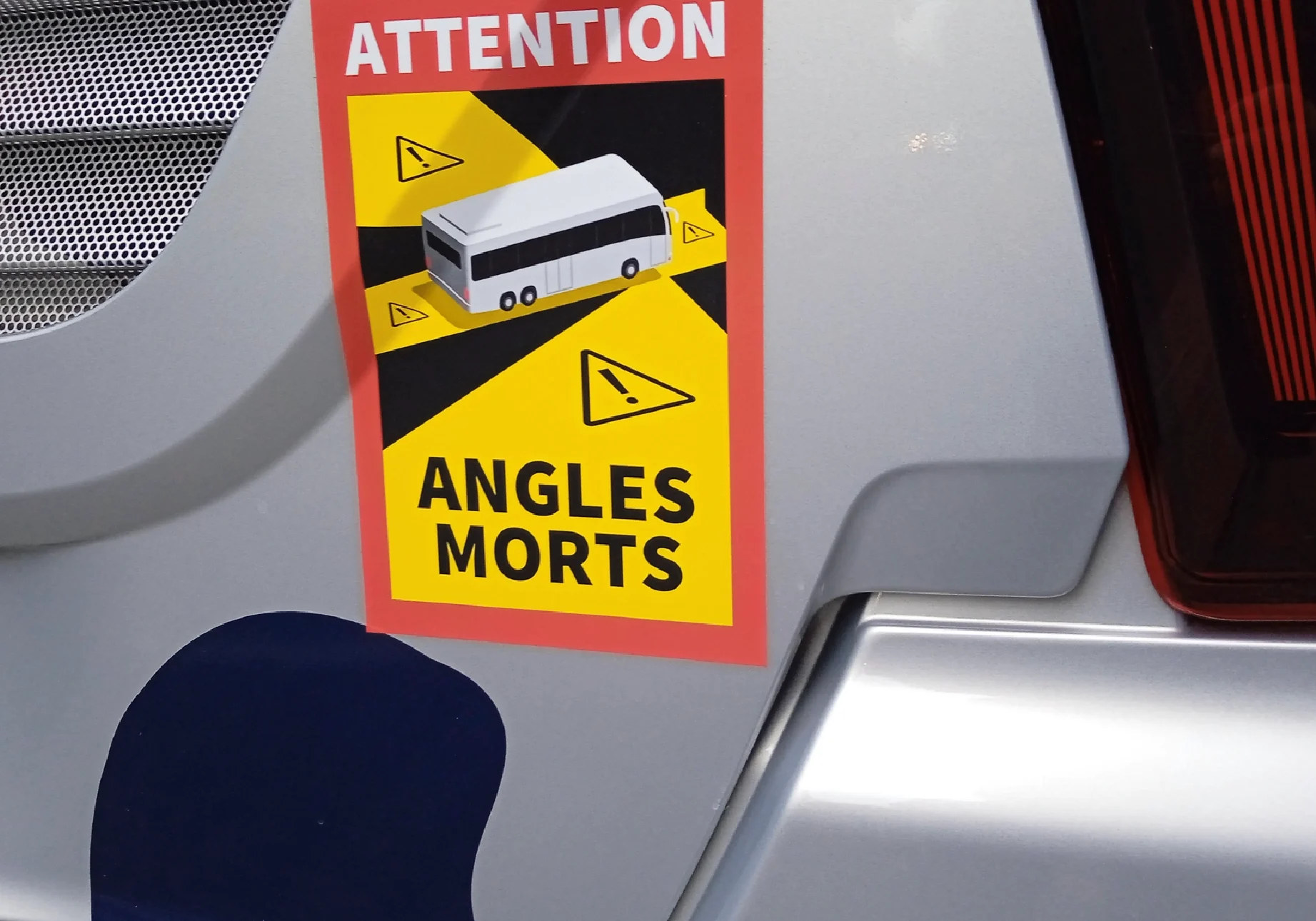 Warning sign for blind spots on vehicle.