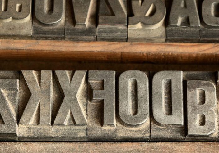 Reversed vintage letterpress printing blocks.