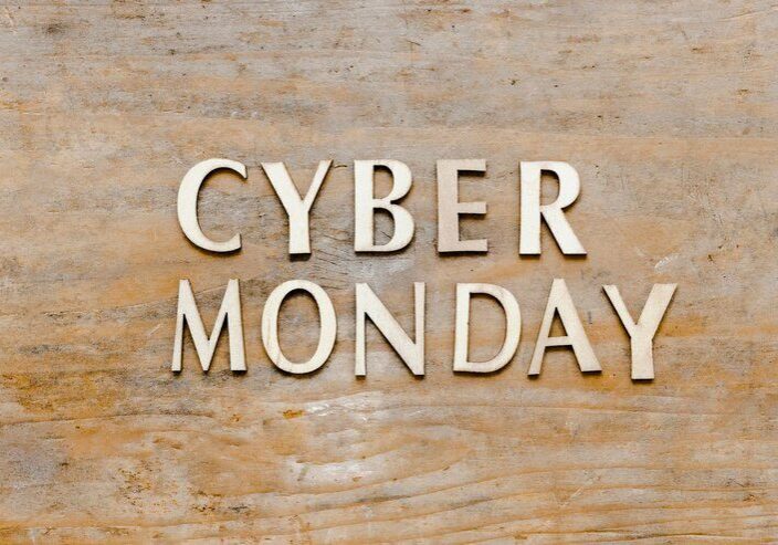 Cyber Monday text on wooden background.