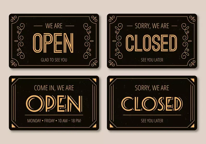Open and closed signs with decorative designs.